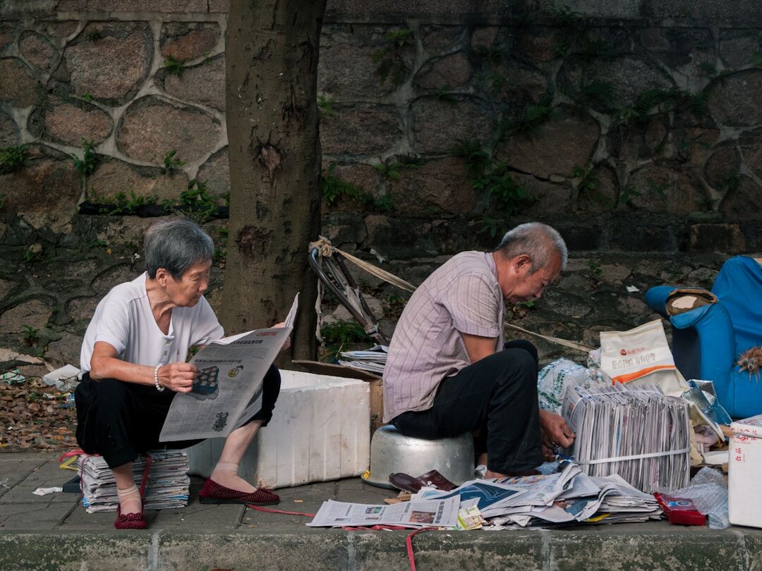 elderly couple reading news