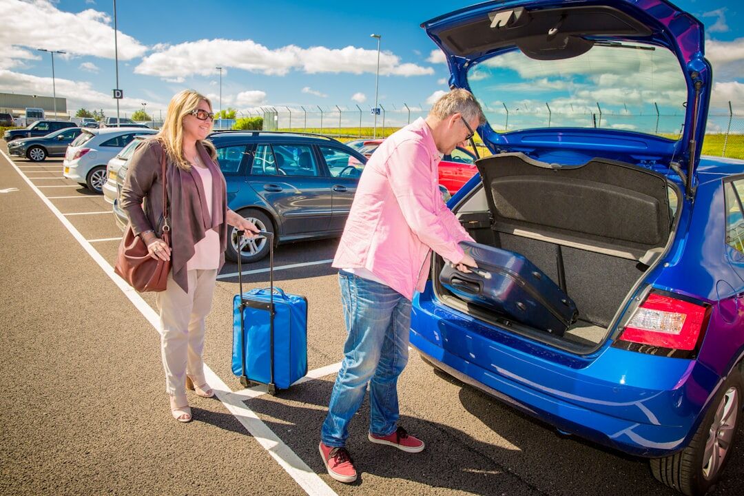 senior couple packing luggage